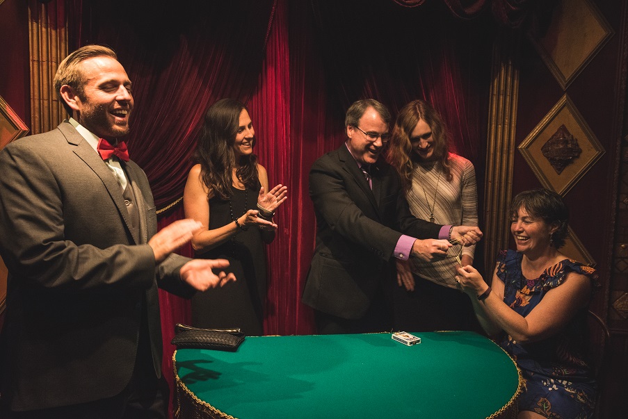 Rick Hebert performing close-up magic for delighted guests at the Magic Castle in Hollywood